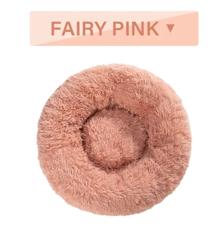 The fluffy donut pet bed shown empty against a plain background