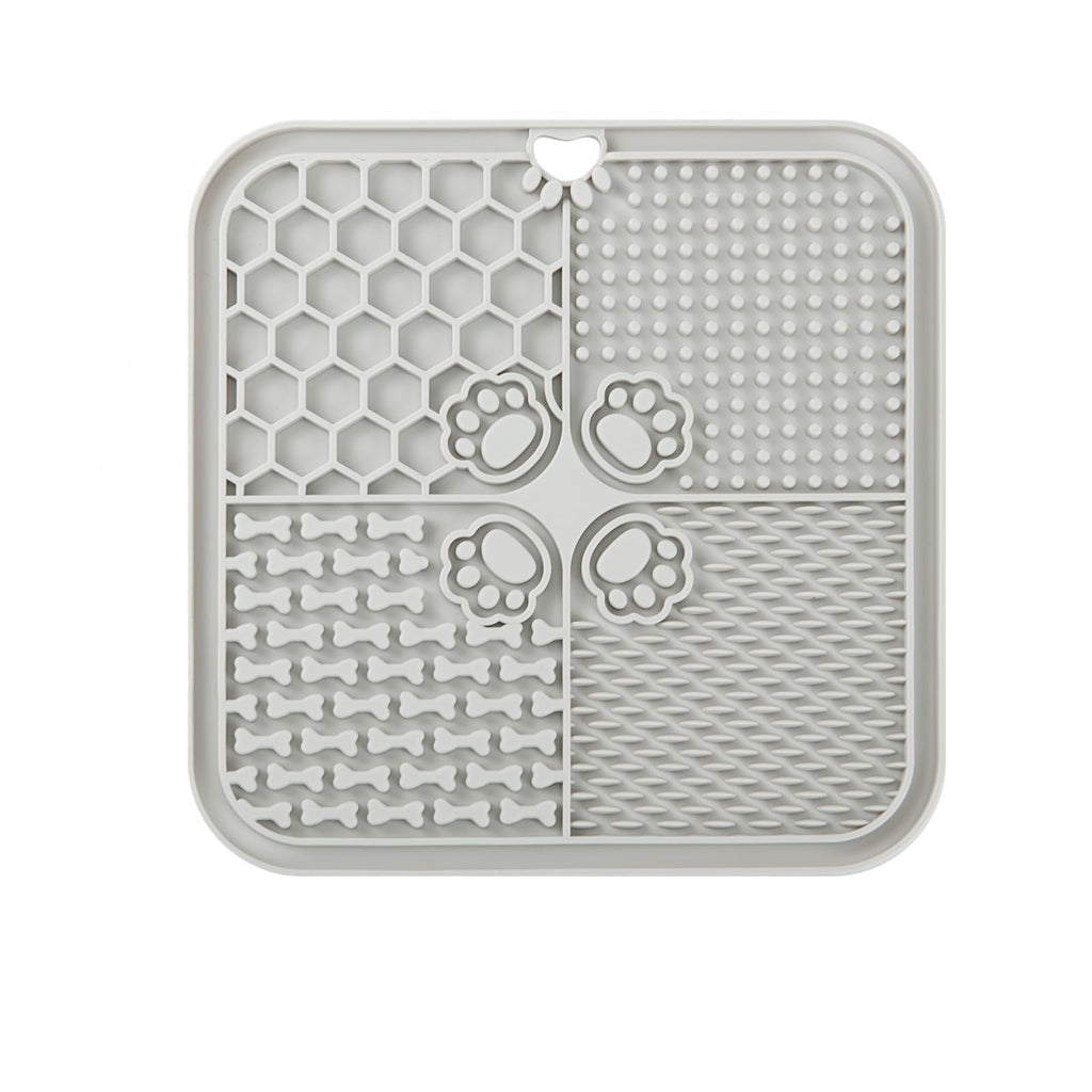 Grey lick mat shown from the back with its suction cup backing