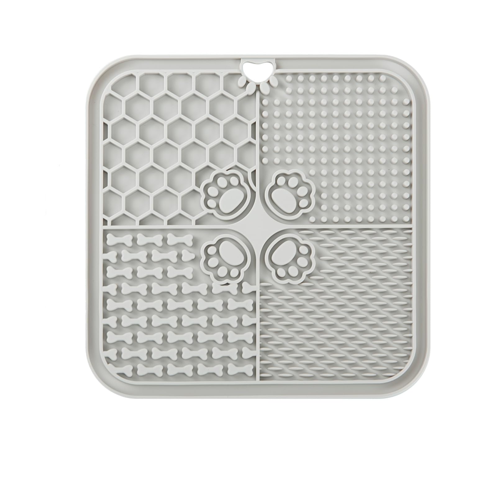 Grey lick mat shown from the back with its suction cup backing