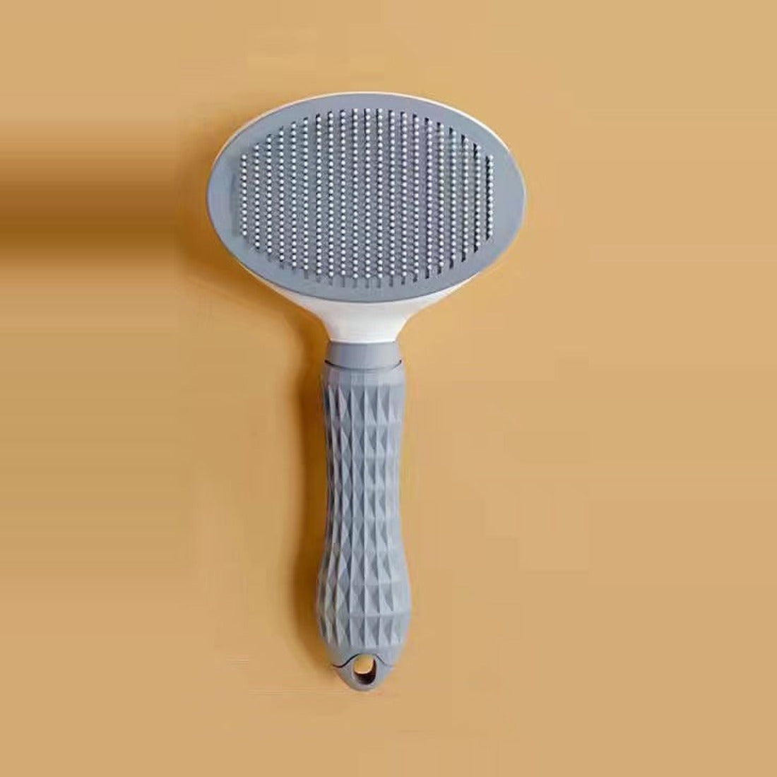 Self-cleaning cat hair remover brush in grey