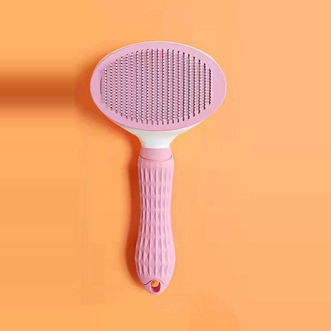 Self-cleaning cat hair remover brush in pink