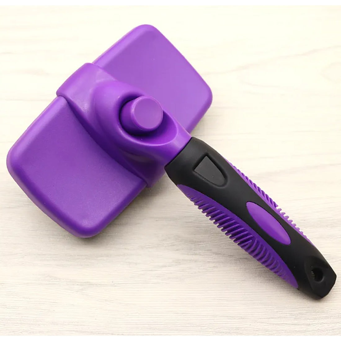 Self-cleaning deshedding comb in purple
