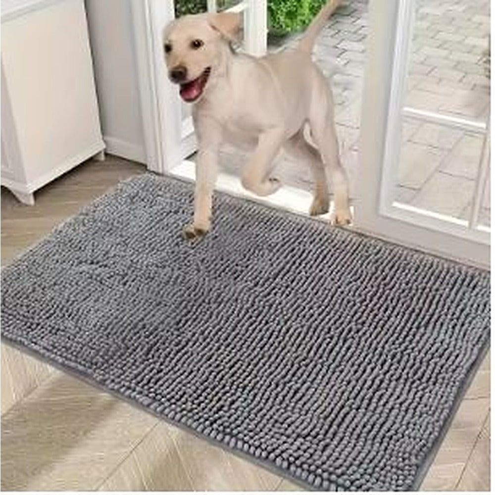 Muddy Paw Door Mat in grey at a patio door with a yellow lab stepping onto it
