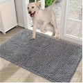 Muddy Paw Door Mat in grey at a patio door with a yellow lab stepping onto it